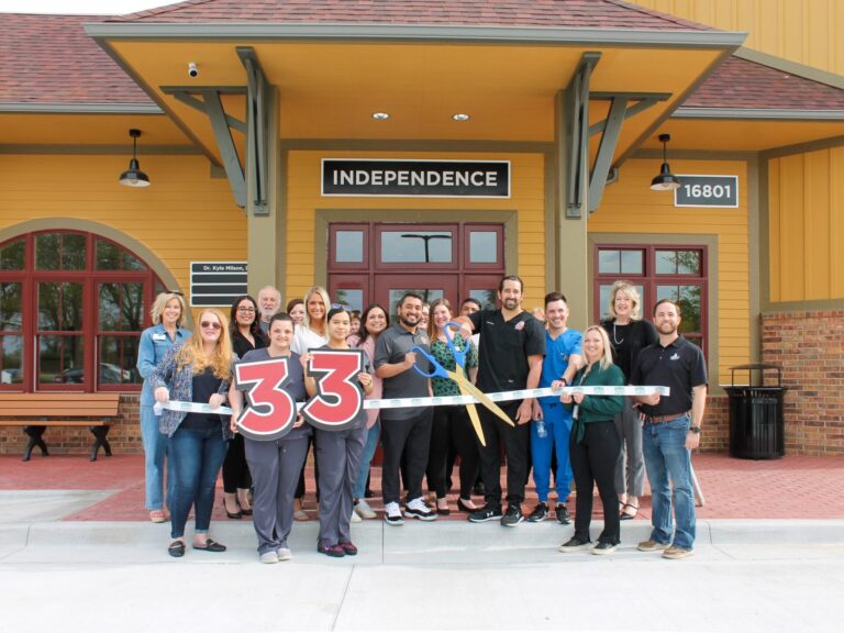 The Independence Dental Depot opening photo cutting the ribbon